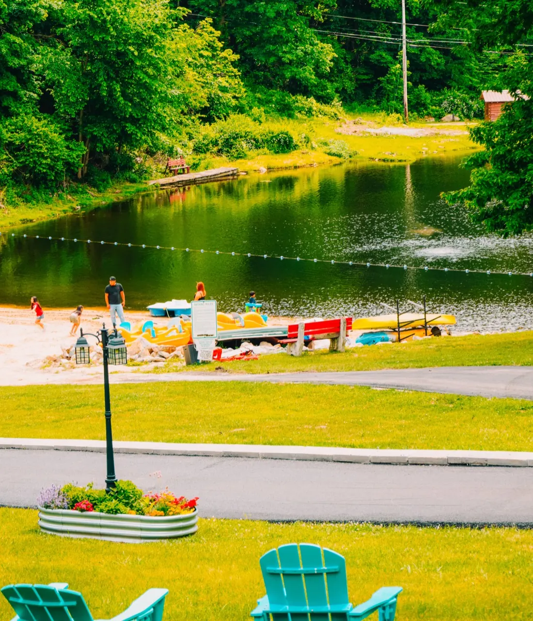Thumbnail: Beach and lake path at Woodland Trails Campground
